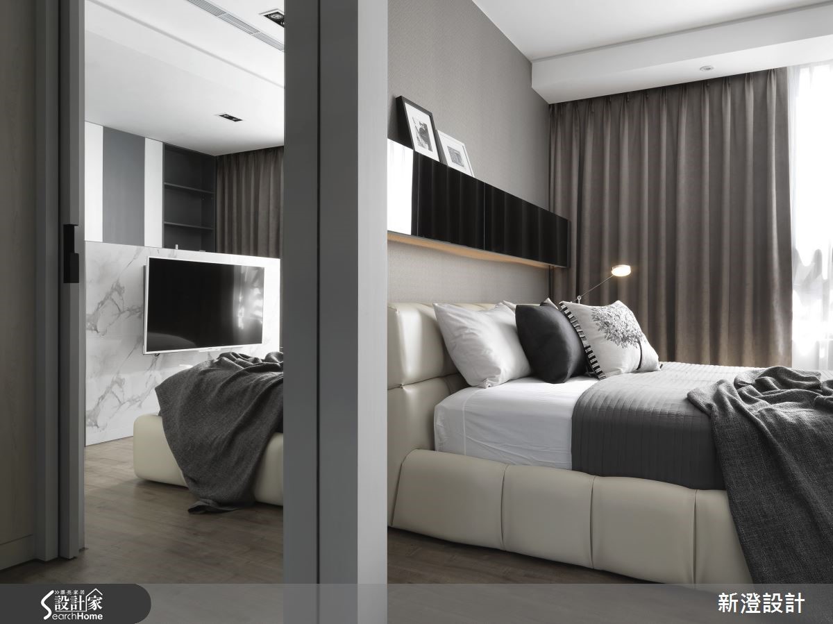 設計師為一家三口的 50 坪的預售屋，利用石材紋理與鏡